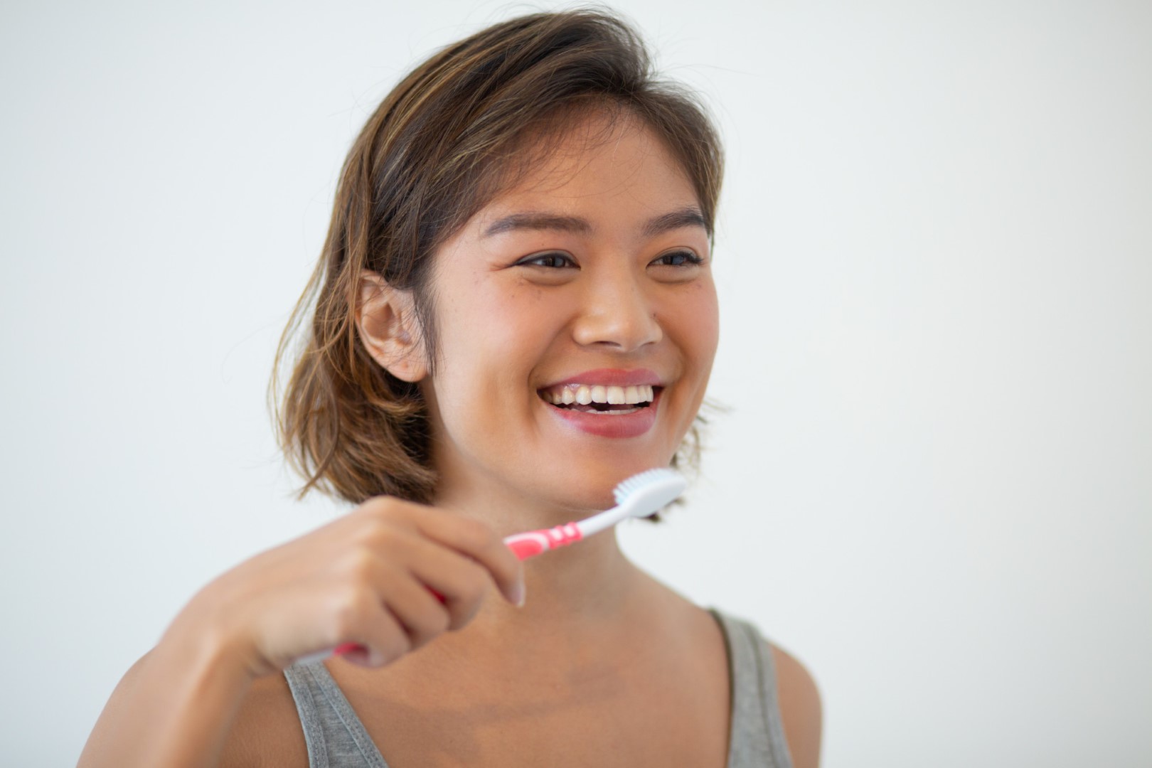 asian woman teeth smiling-pretty-asian-woman-brushing-teeth (Large)