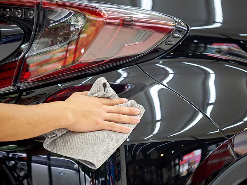 person polishing car