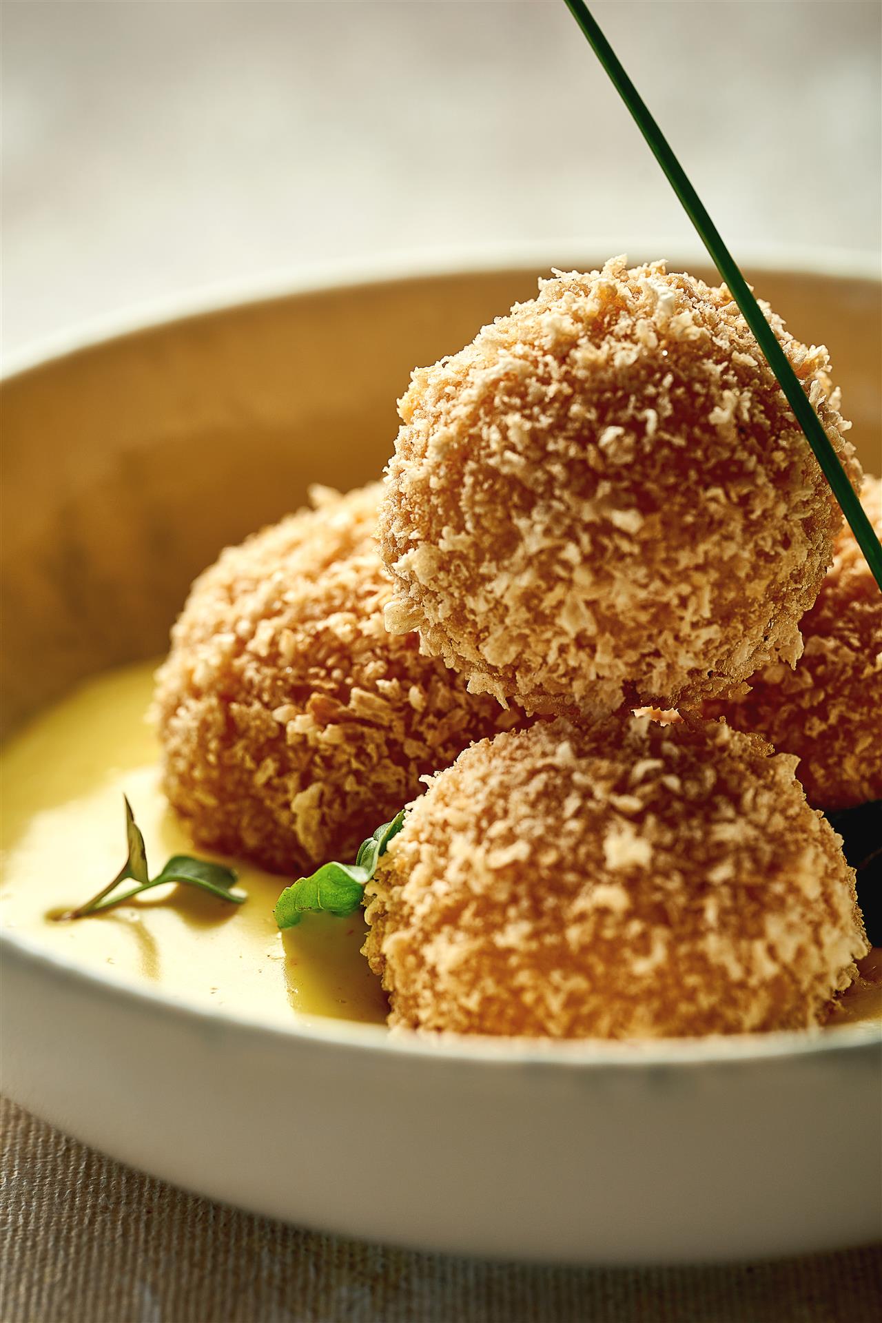 Croquette with shrimp in cheese sauce. Close-up selective focus Plant-based ebi ball