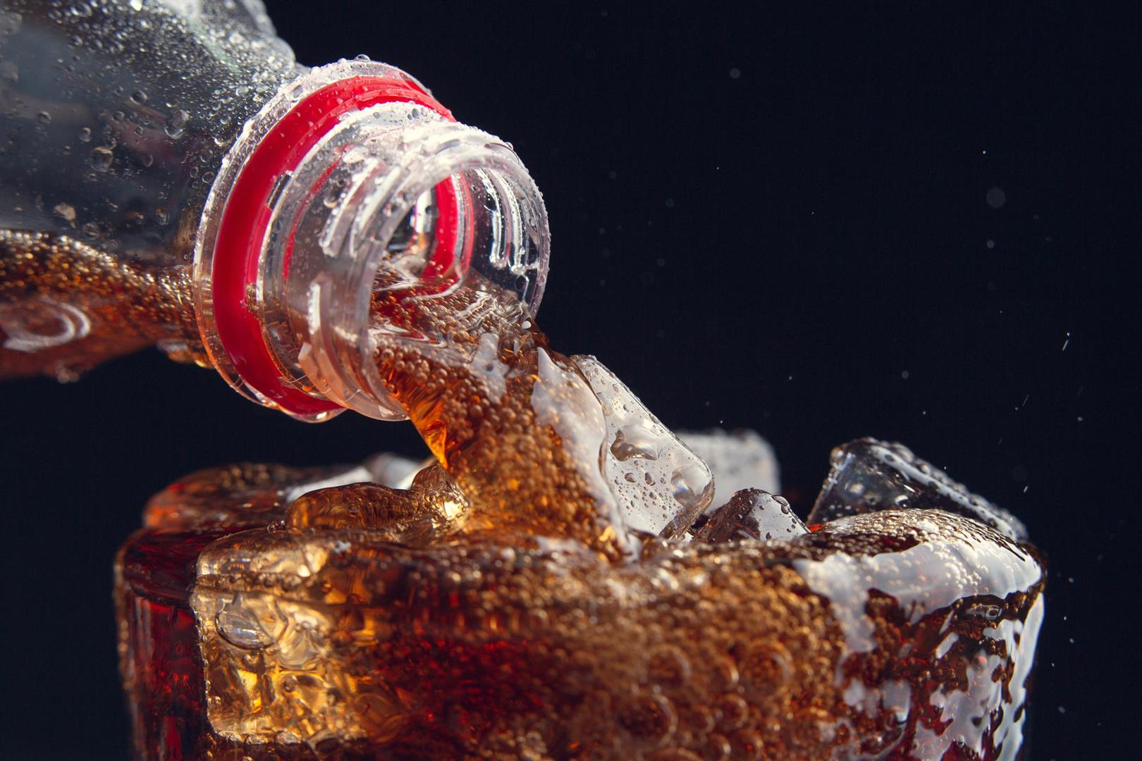 serving-cola-from-bottle-glass-full-ice (Large) serving-cola-from-bottle-glass-full-ice (Large)